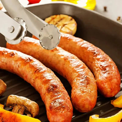 Grilled sausages with barbecue tongs in a grill pan, surrounded by peppers and mushrooms